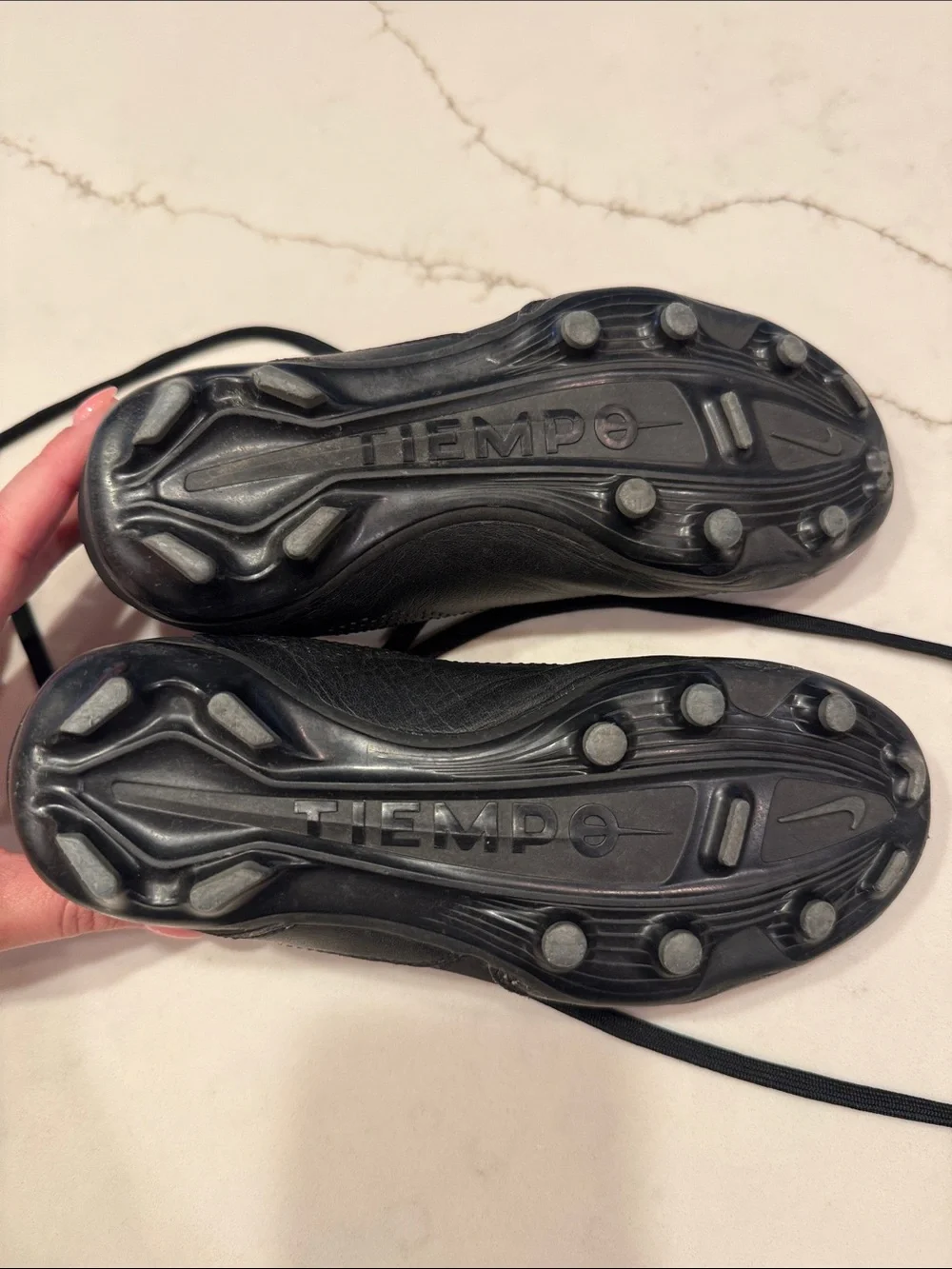 Nike Youth Black Athletic Cleats with Light Blue Swoosh